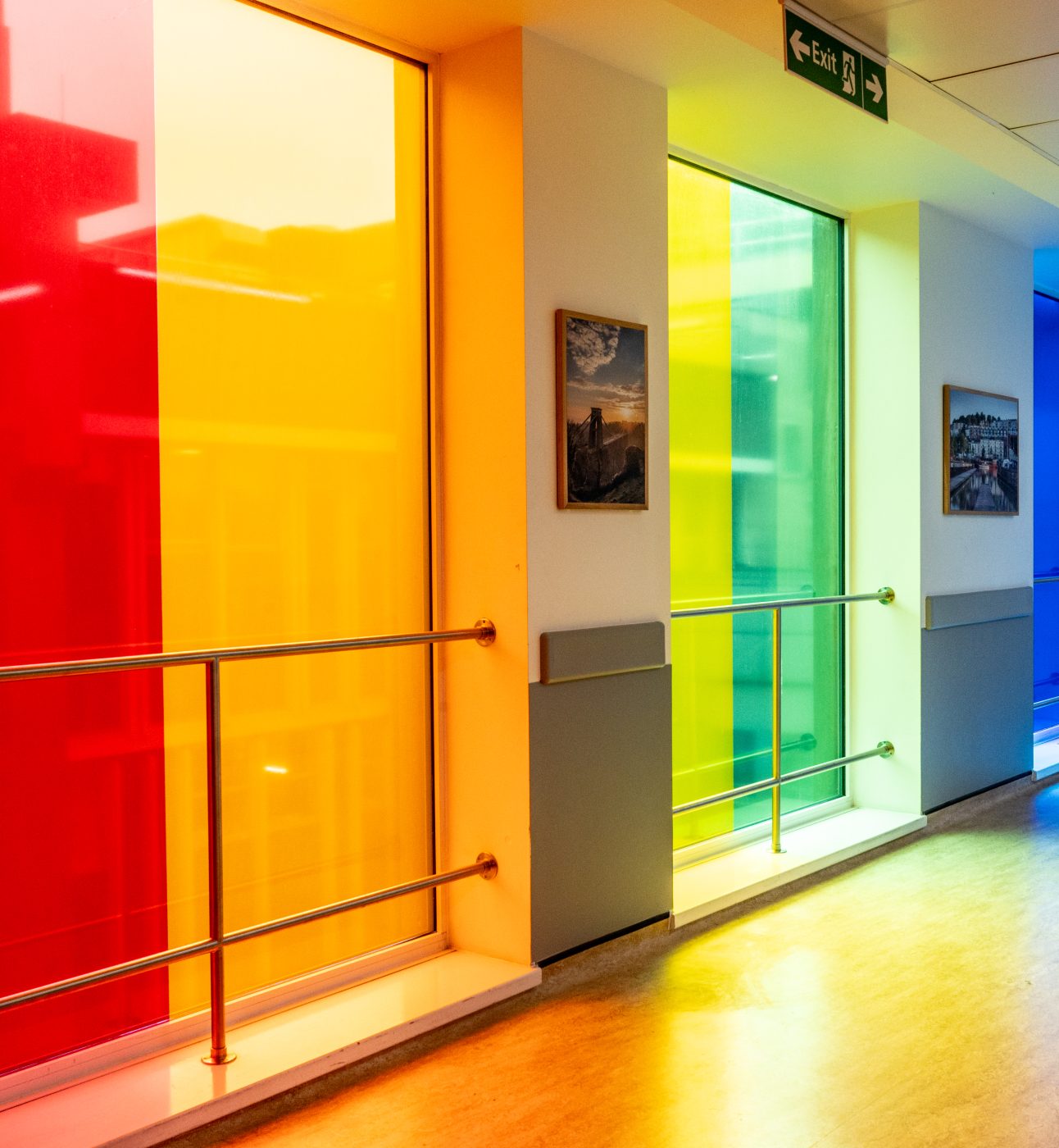 A picture taken in a hospital showing windows of many different colours.
